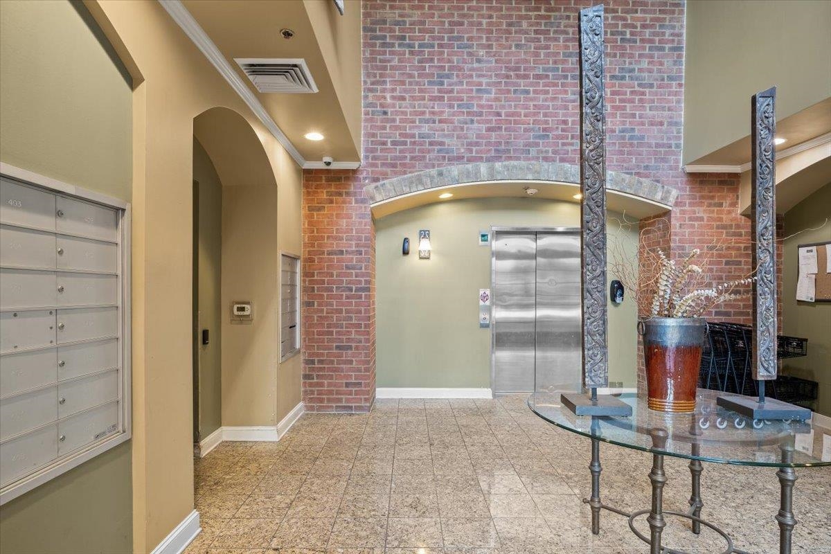 665 Tennessee Street, Unit 411 Memphis, TN 38103 - Photo 5 of 29 a bathroom with a tub and shower