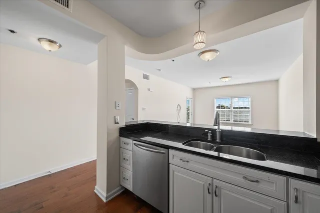 a kitchen with a sink and a window