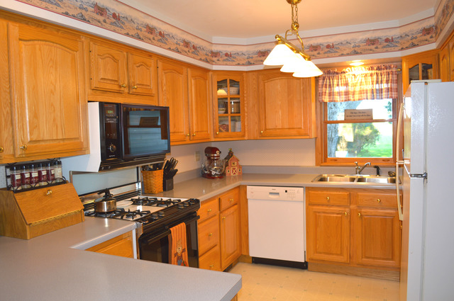 44-w703 Rowe Road Elburn, IL 60119 - Photo 8 of 25 a kitchen with a sink stove and microwave