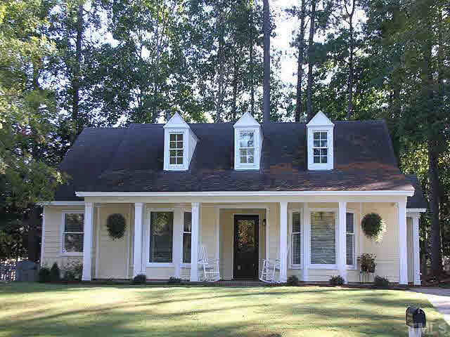 5809 Edgebury Road Raleigh, NC 27613 - Photo 1 of 12 a front view of a house with a porch