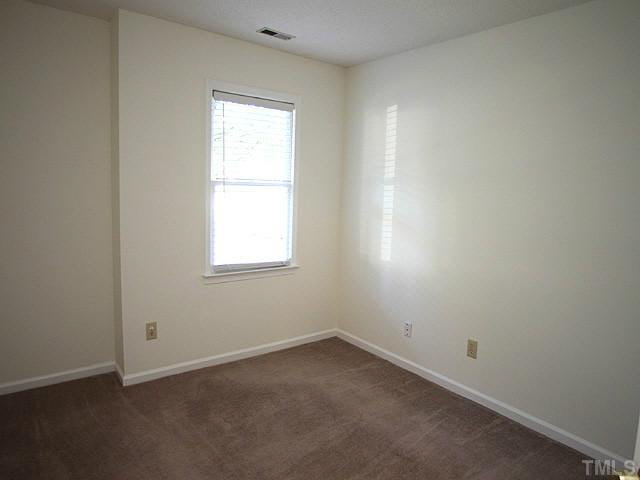 5809 Edgebury Road Raleigh, NC 27613 - Photo 11 of 12 an empty room with a window