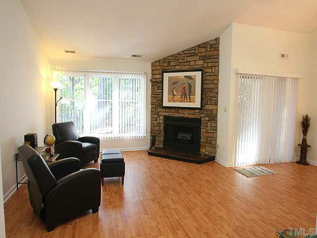 5809 Edgebury Road Raleigh, NC 27613 - Photo 2 of 12 a living room with furniture and a fireplace