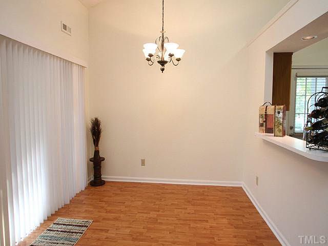 5809 Edgebury Road Raleigh, NC 27613 - Photo 4 of 12 a view of a room with window and hardwood floor