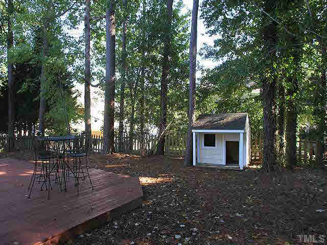 5809 Edgebury Road Raleigh, NC 27613 - Photo 7 of 12 a view of a house with backyard and sitting area