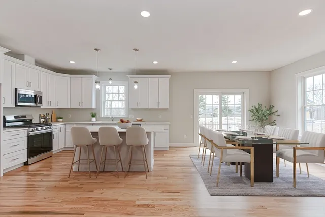 a view of a dining room with furniture window and wooden floor