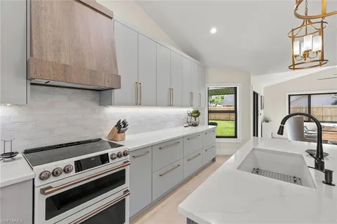 a kitchen with a stove and a sink
