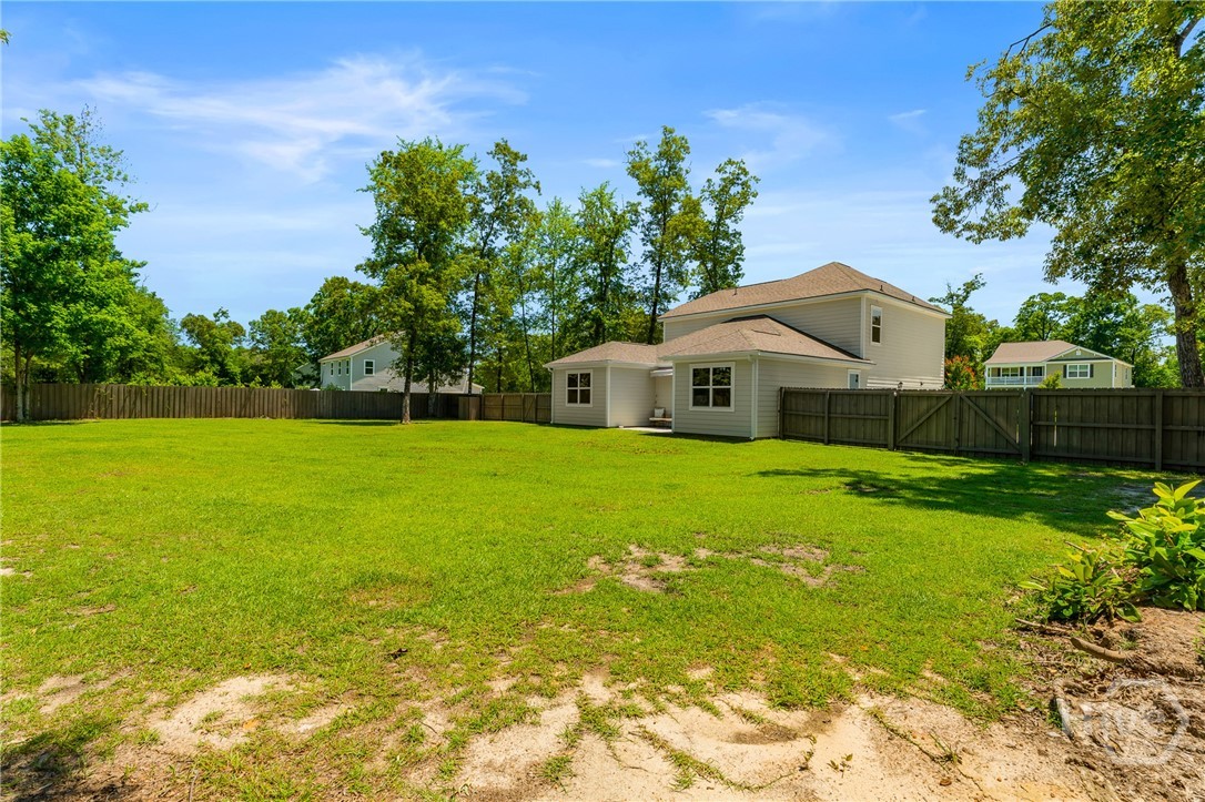 132 Ramsey Way Rincon, GA 31326 - Photo 51 of 59 A fully fenced 0.75-acre backyard that gives you room to actually live outside.