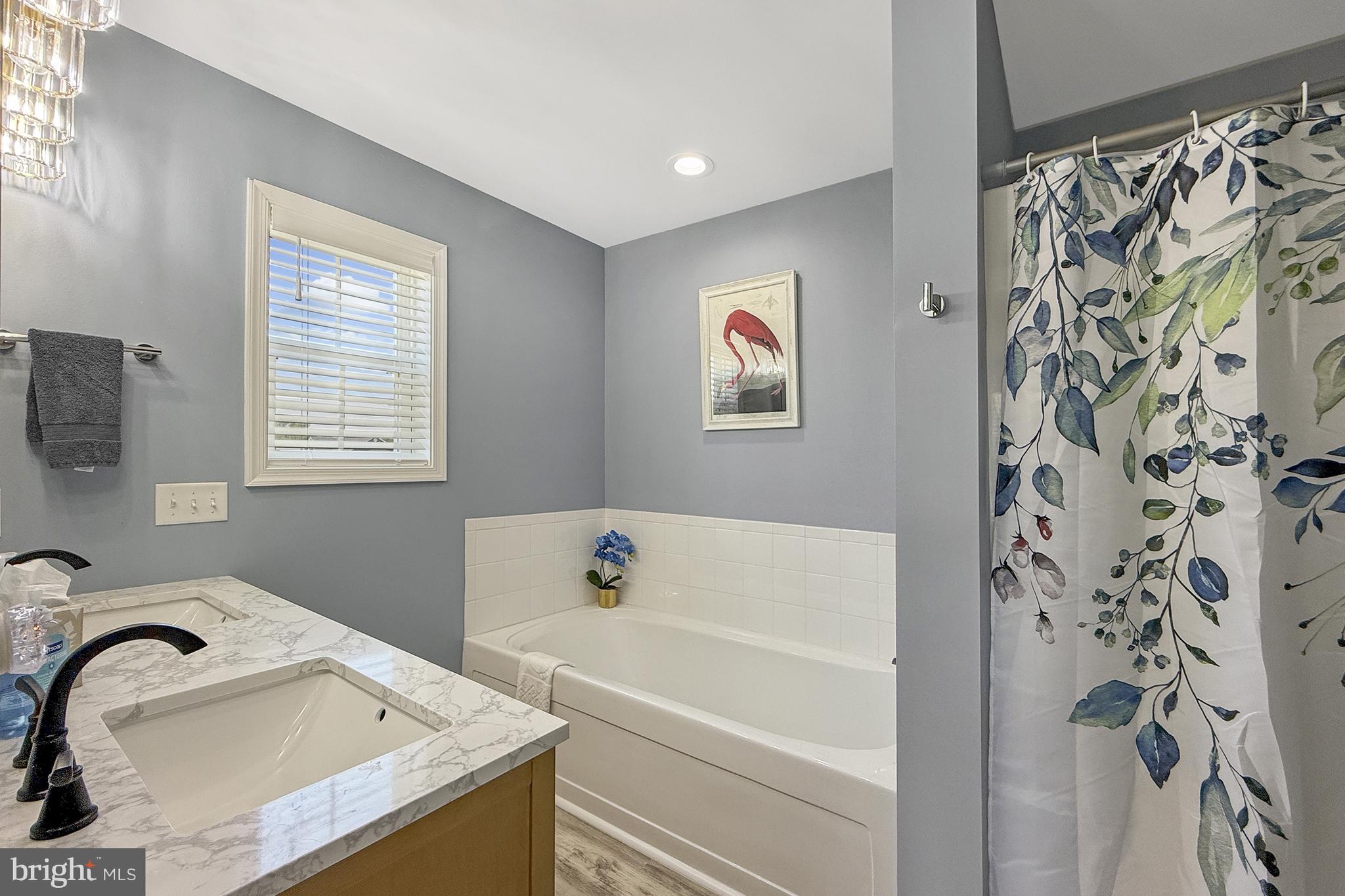 87 Trapper Lane Magnolia, DE 19962 - Photo 23 of 39 a bathroom with a sink and a bathtub