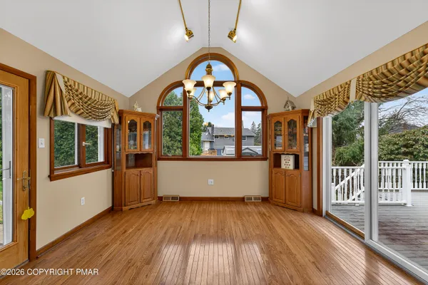 a room with furniture and a wooden floor