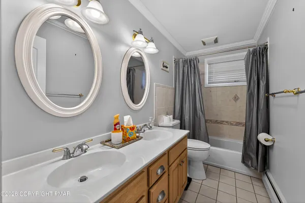an aerial view of a house with a yard basket ball court and outdoor seating
