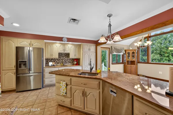 a large kitchen with granite countertop lots of counter top space