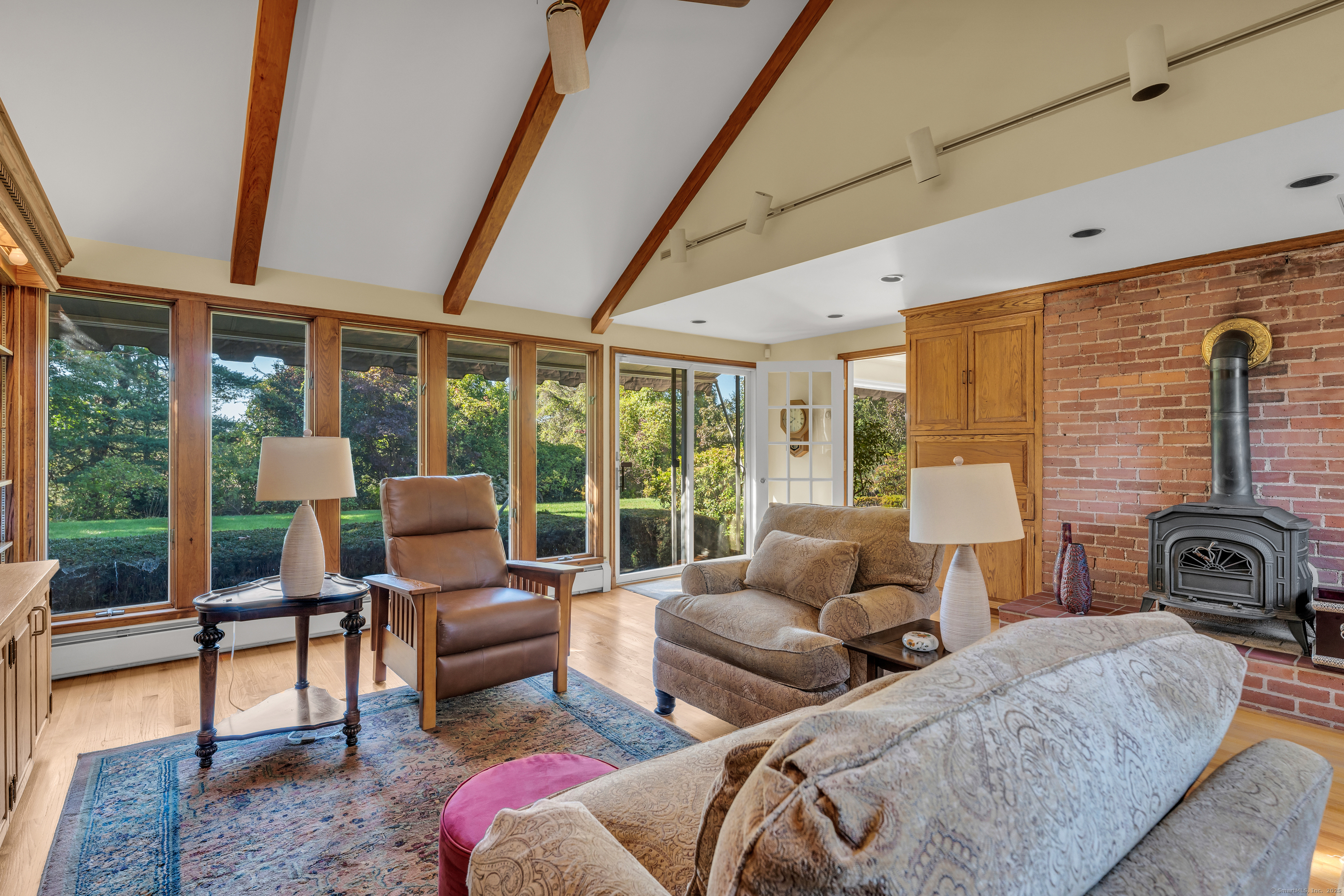 1060 Ridge Road Hamden, CT 06517 - Photo 12 of 40 a living room with furniture and a floor to ceiling window