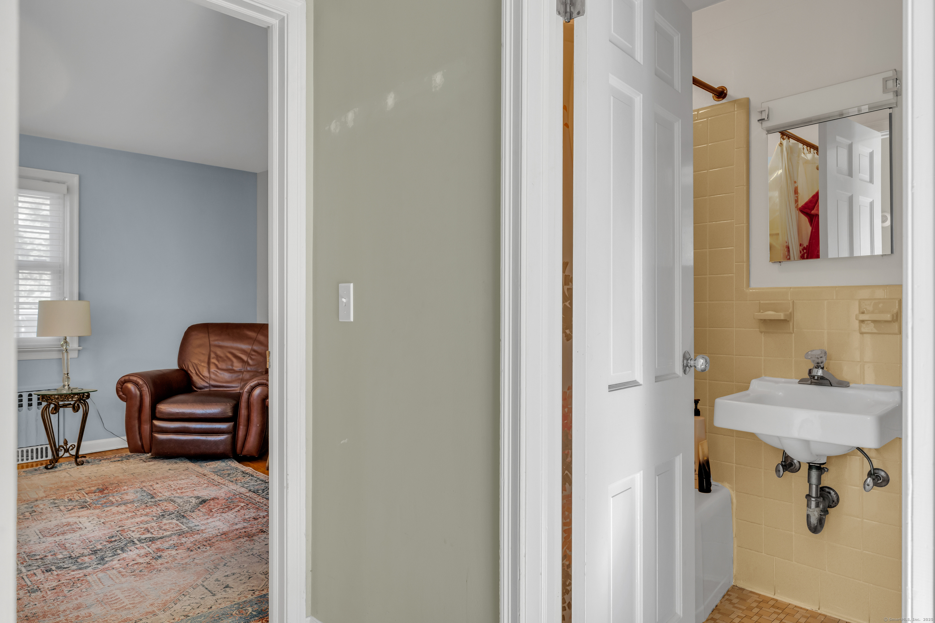 1060 Ridge Road Hamden, CT 06517 - Photo 19 of 40 a bathroom with a sink and a mirror