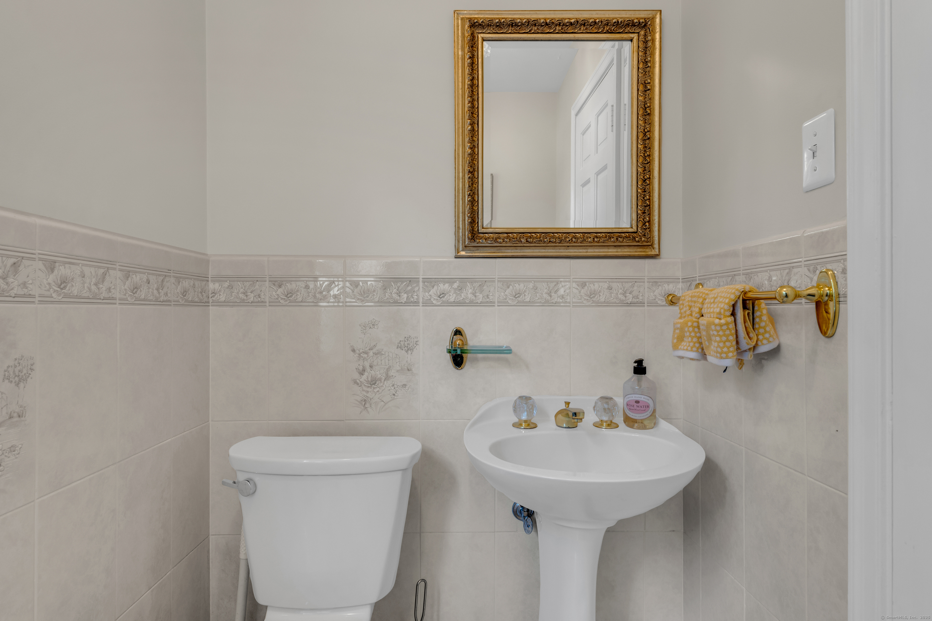 1060 Ridge Road Hamden, CT 06517 - Photo 23 of 40 a bathroom with a sink a toilet and mirror