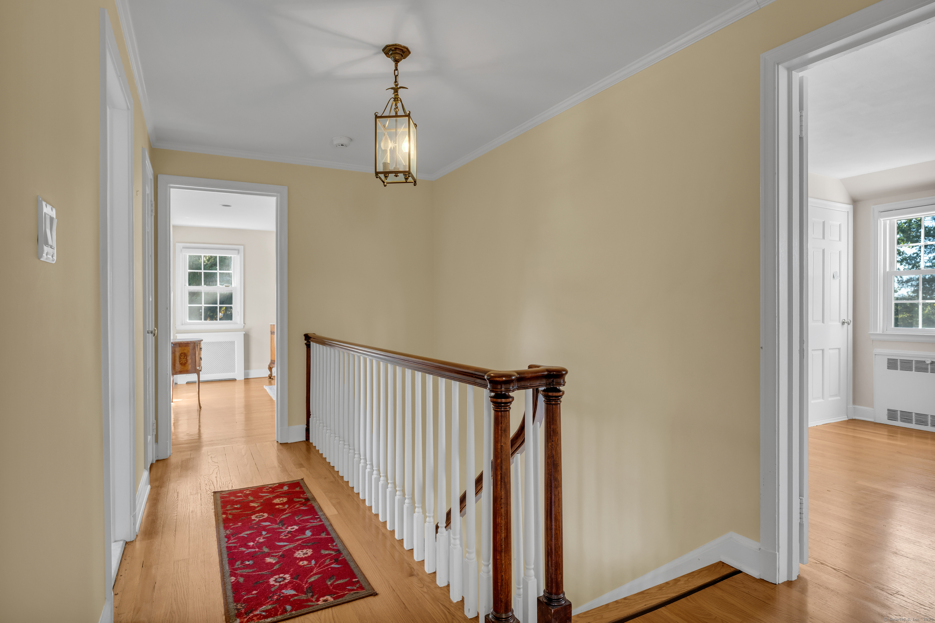 1060 Ridge Road Hamden, CT 06517 - Photo 24 of 40 a view of a hallway with windows and stairs