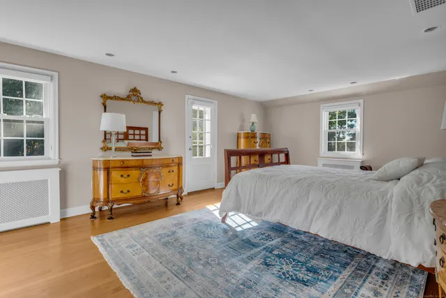 a bed room with a bed and a television