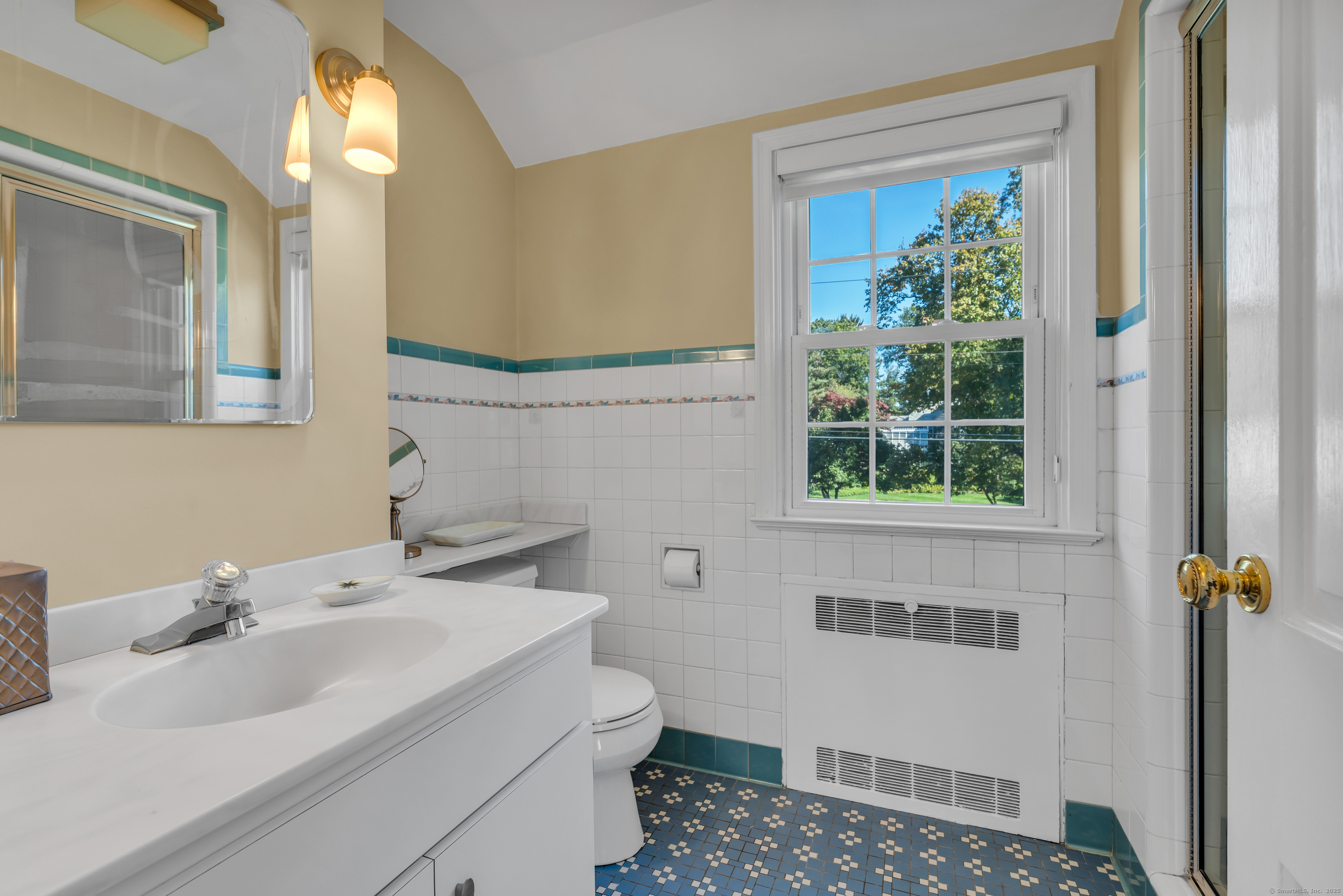 1060 Ridge Road Hamden, CT 06517 - Photo 27 of 40 a bathroom with a sink toilet and a mirror