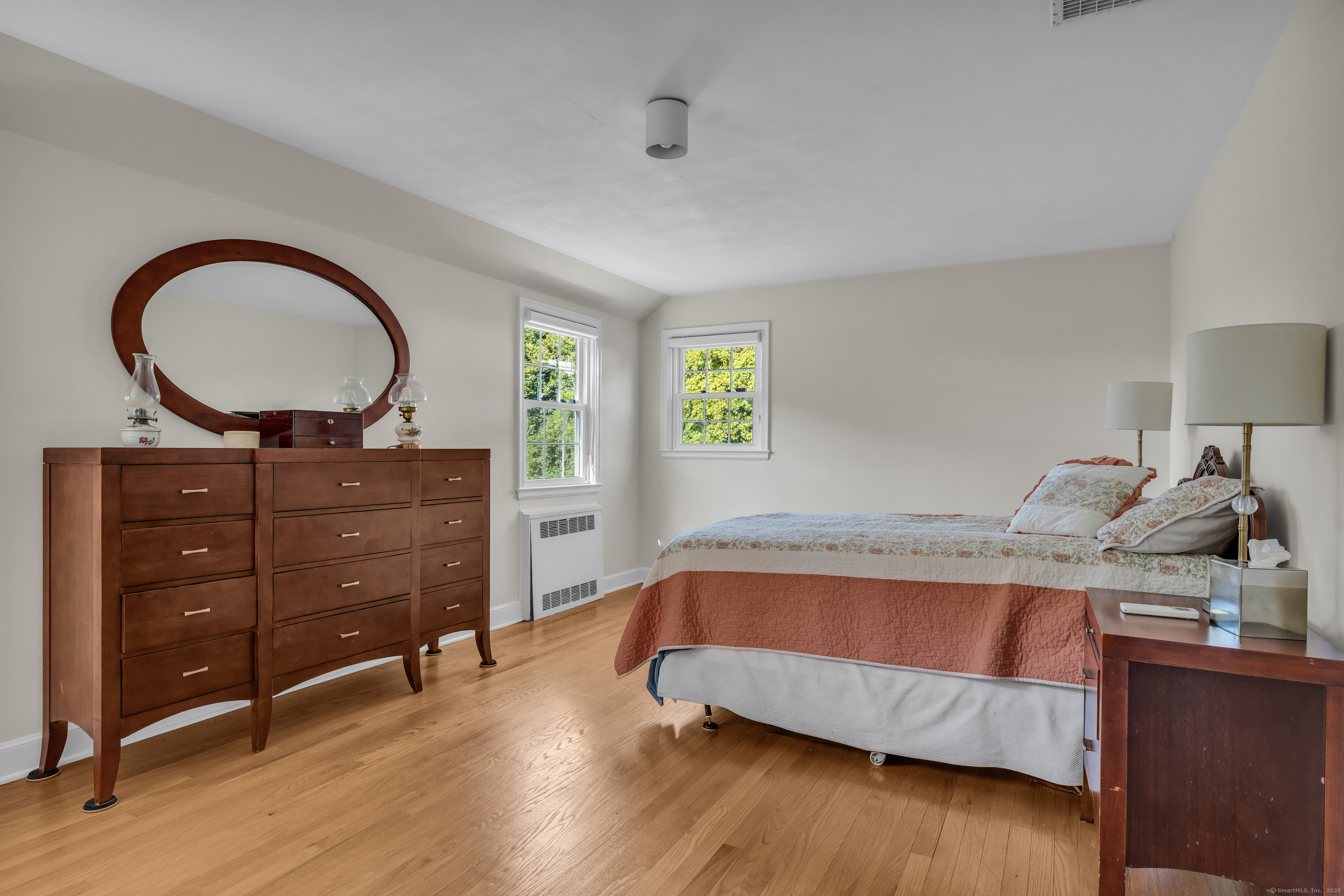 1060 Ridge Road Hamden, CT 06517 - Photo 28 of 40 a bedroom with a bed and a dresser