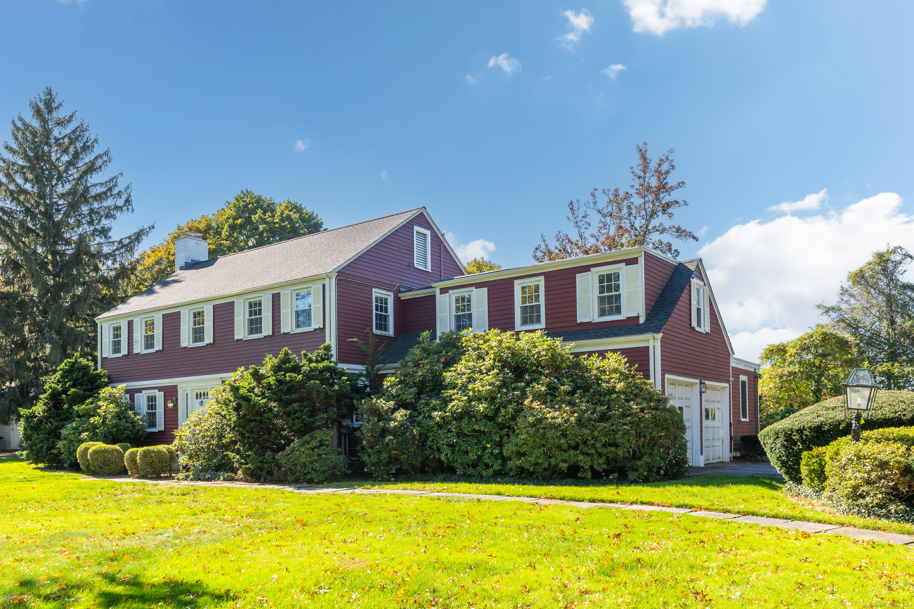 1060 Ridge Road Hamden, CT 06517 - Photo 3 of 40 a front view of a house with swimming pool