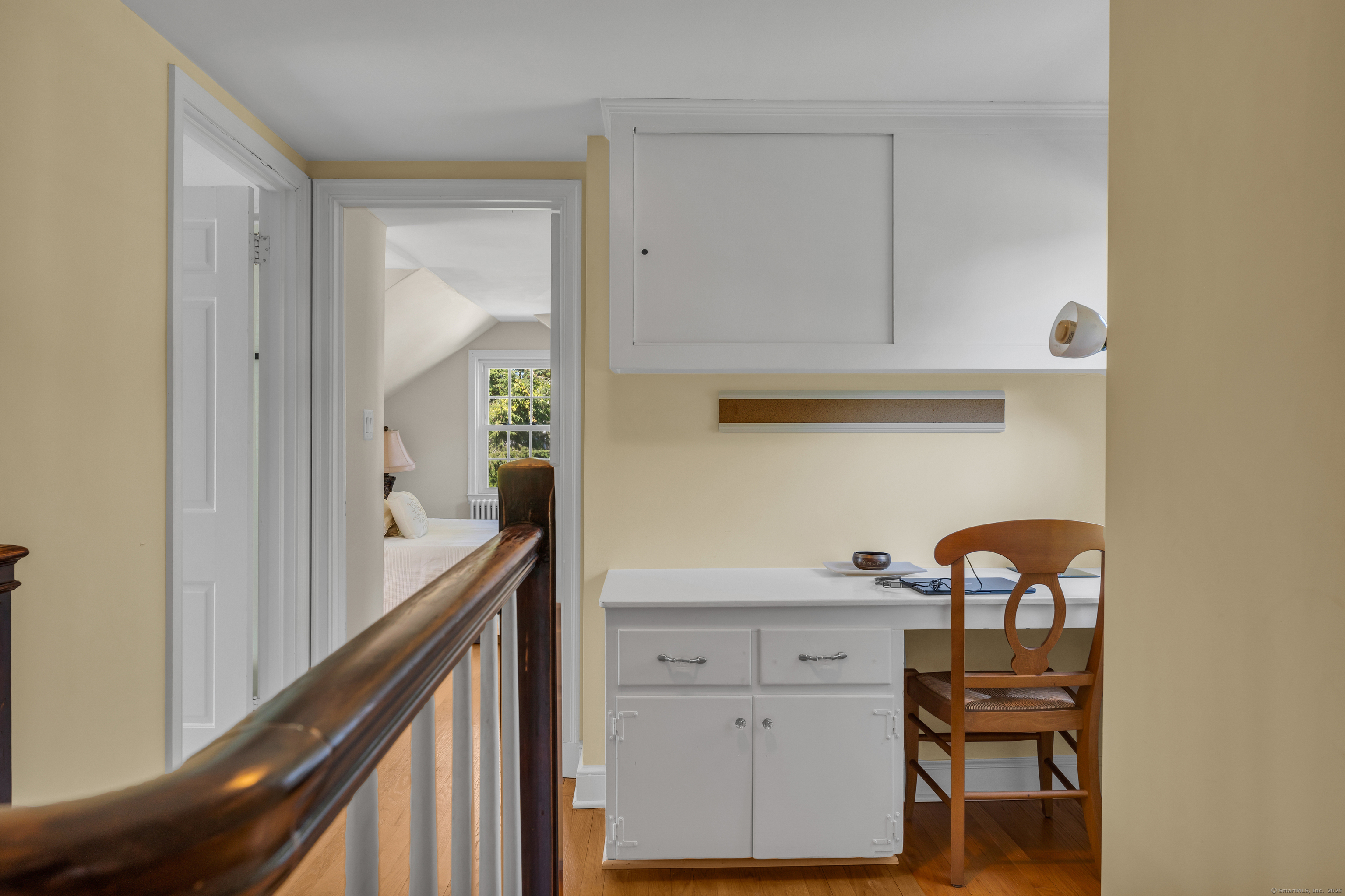 1060 Ridge Road Hamden, CT 06517 - Photo 33 of 40 a view of a hallway to a livingroom and furniture