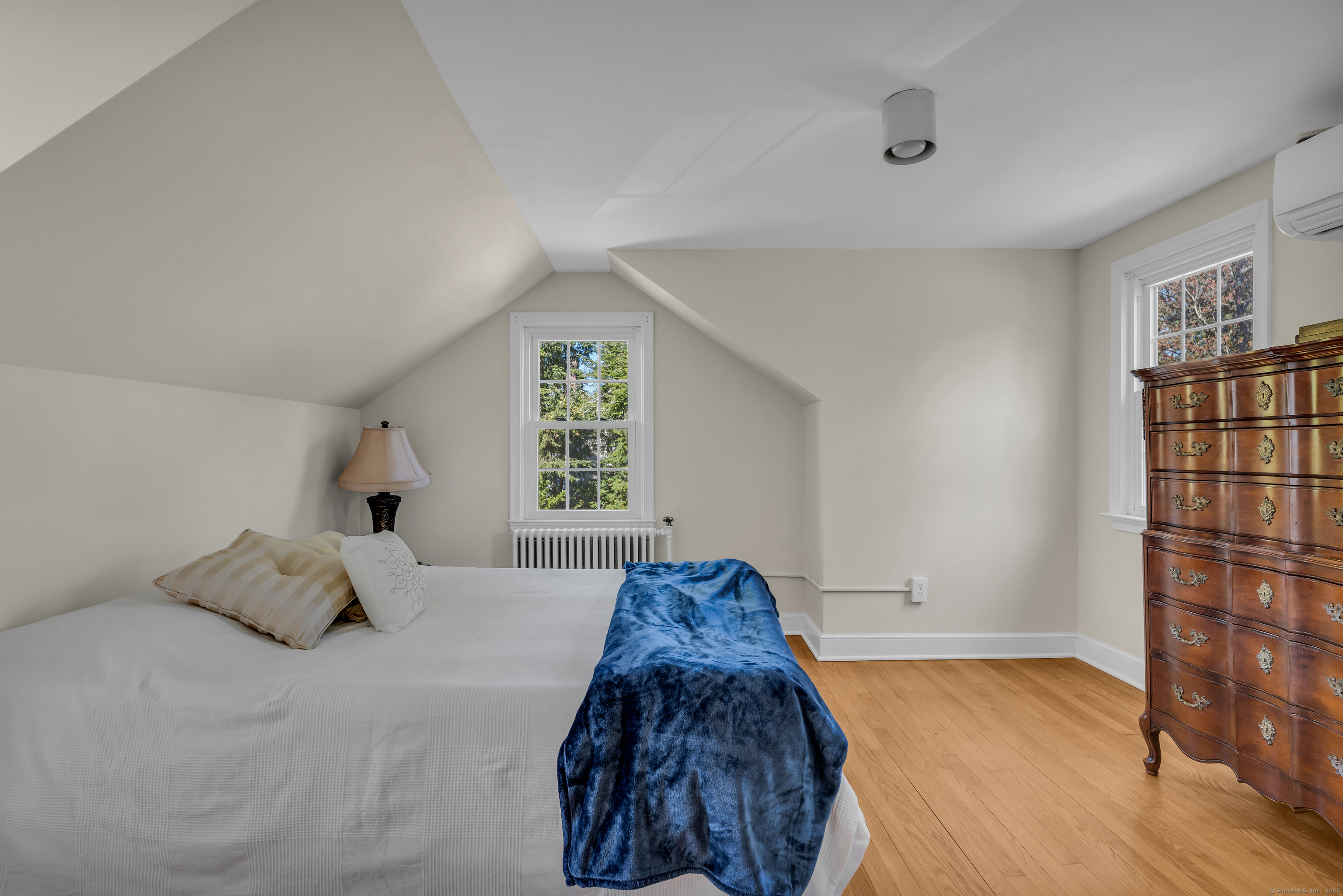 1060 Ridge Road Hamden, CT 06517 - Photo 35 of 40 a bed sitting in a bedroom next to a window