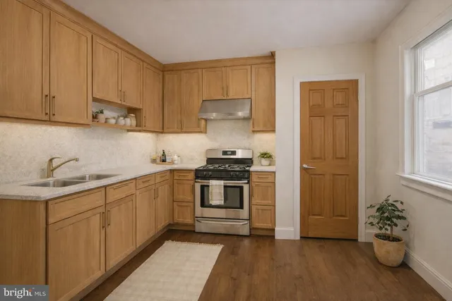 a view of workspace with window and cabinet