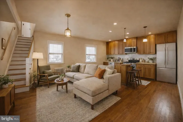 a bathroom with a granite countertop sink a mirror and a shower