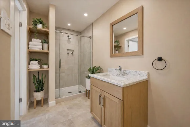 a view of an empty room with a fireplace and a window