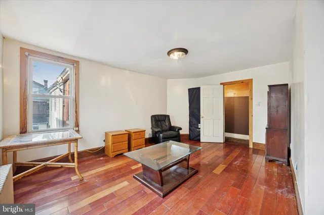 a view of an empty room with windows