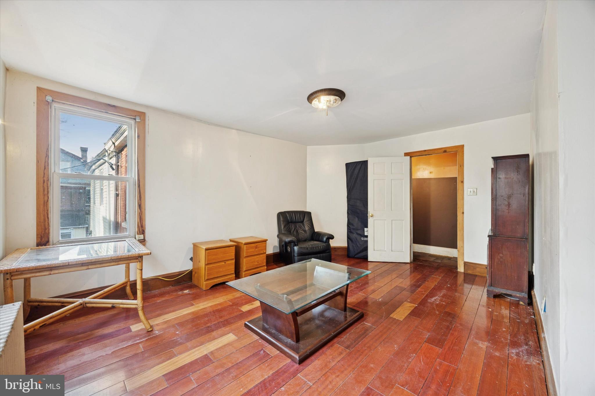 5124 Newhall Street Philadelphia, PA 19144 - Photo 27 of 35 a living room with furniture and a wooden floor
