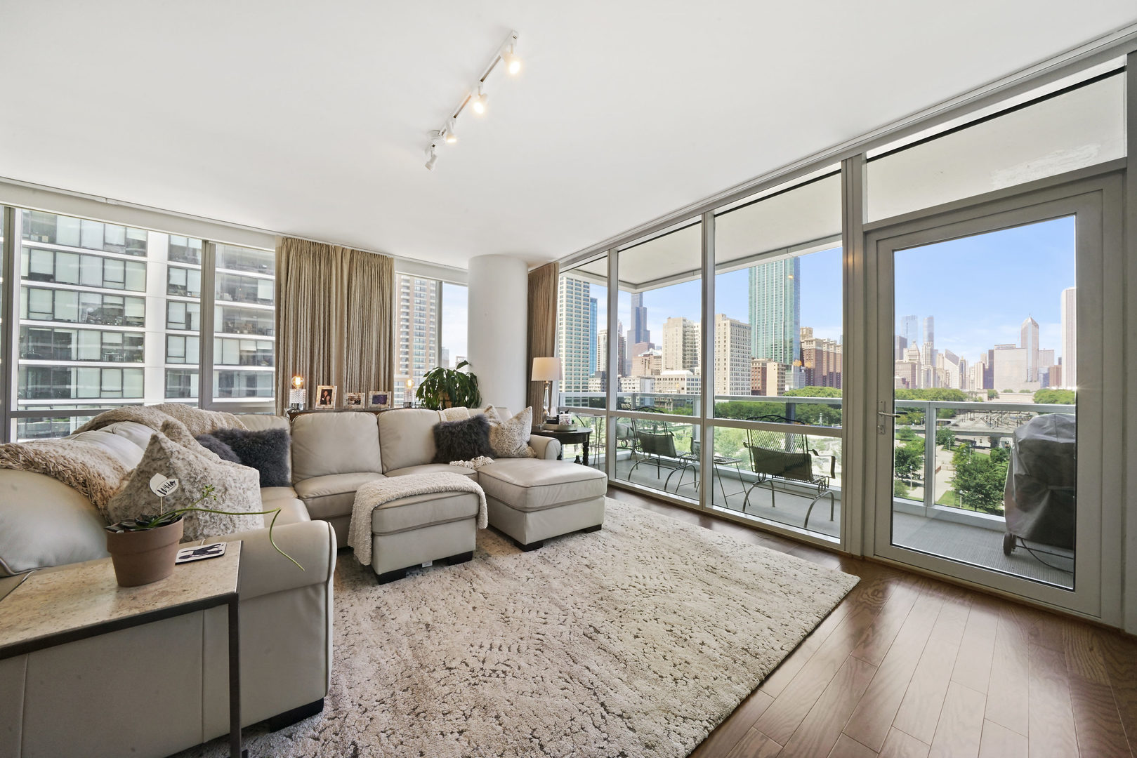 1201 South Prairie Avenue, Unit 601 Chicago, IL 60605 - Photo 2 of 52 a living room with furniture and large windows