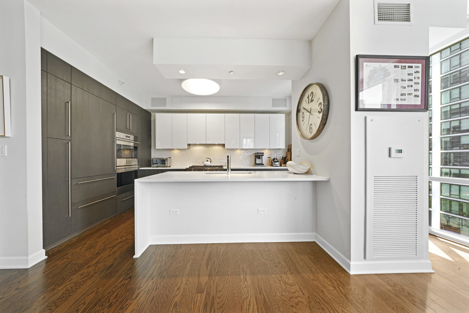 1201 South Prairie Avenue, Unit 601 Chicago, IL 60605 - Photo 12 of 52 a kitchen with a refrigerator and a stove top oven