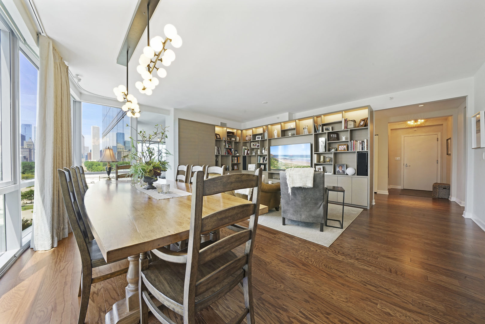 1201 South Prairie Avenue, Unit 601 Chicago, IL 60605 - Photo 13 of 52 a dining room with furniture a chandelier and wooden floor