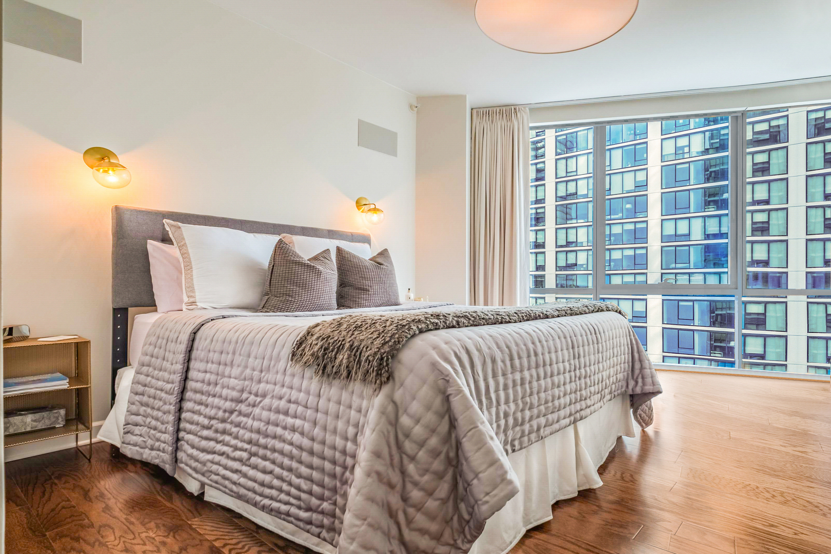 1201 South Prairie Avenue, Unit 601 Chicago, IL 60605 - Photo 22 of 52 a bed sitting in a bedroom next to a window