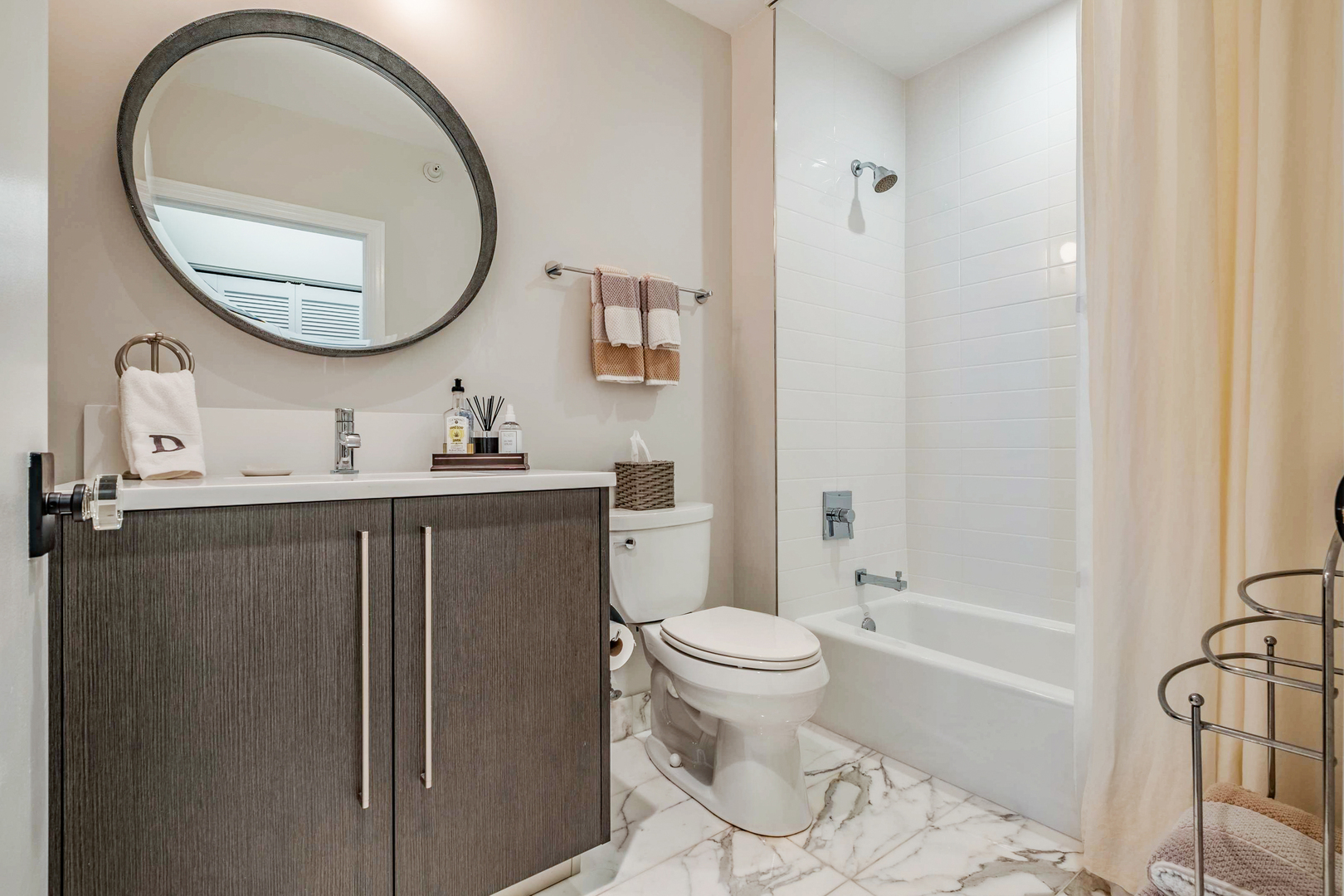 1201 South Prairie Avenue, Unit 601 Chicago, IL 60605 - Photo 23 of 52 a bathroom with a sink toilet and a mirror