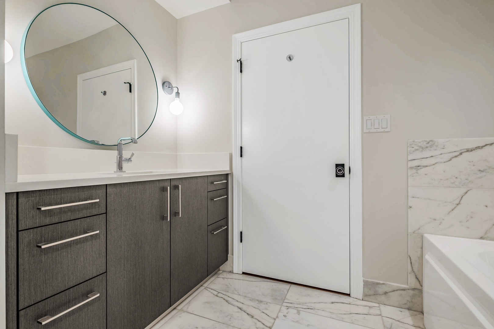 1201 South Prairie Avenue, Unit 601 Chicago, IL 60605 - Photo 27 of 52 a bathroom with a sink a mirror and a vanity