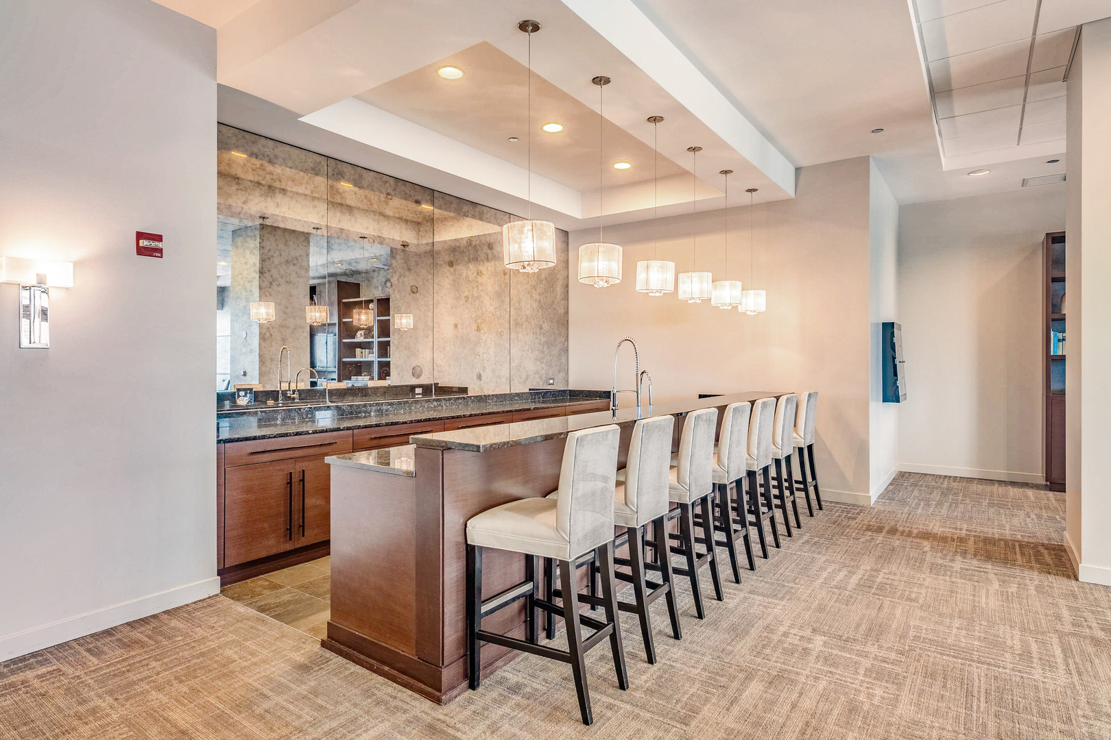 1201 South Prairie Avenue, Unit 601 Chicago, IL 60605 - Photo 31 of 52 a dining hall with stainless steel appliances kitchen island granite countertop a table and chairs in it
