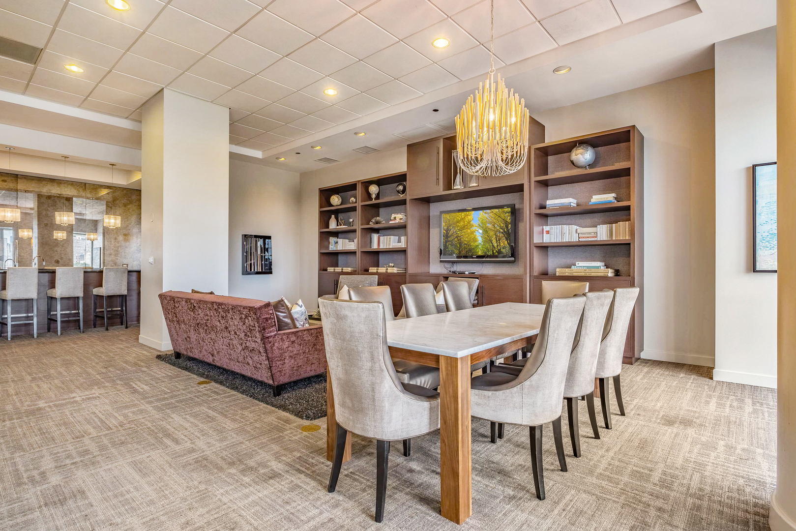 1201 South Prairie Avenue, Unit 601 Chicago, IL 60605 - Photo 32 of 52 a dining room with furniture a chandelier and kitchen view