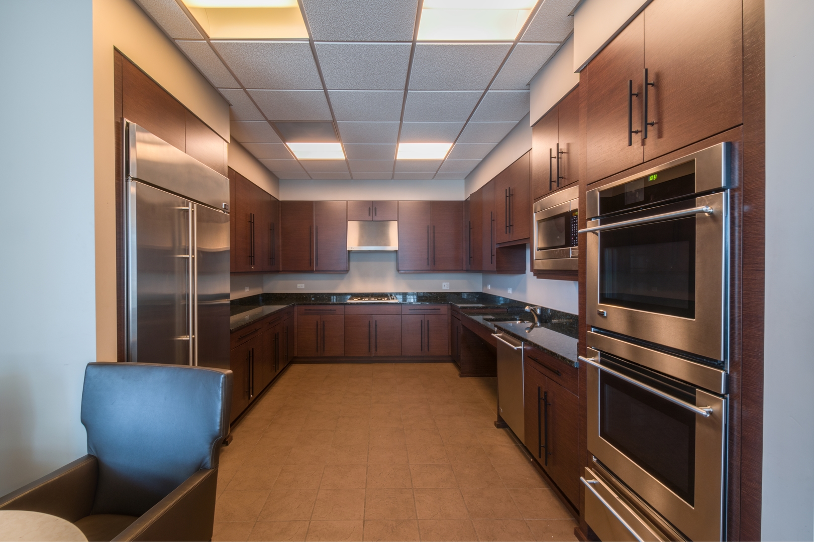 1201 South Prairie Avenue, Unit 601 Chicago, IL 60605 - Photo 37 of 52 a kitchen with stainless steel appliances granite countertop a sink a stove and a refrigerator