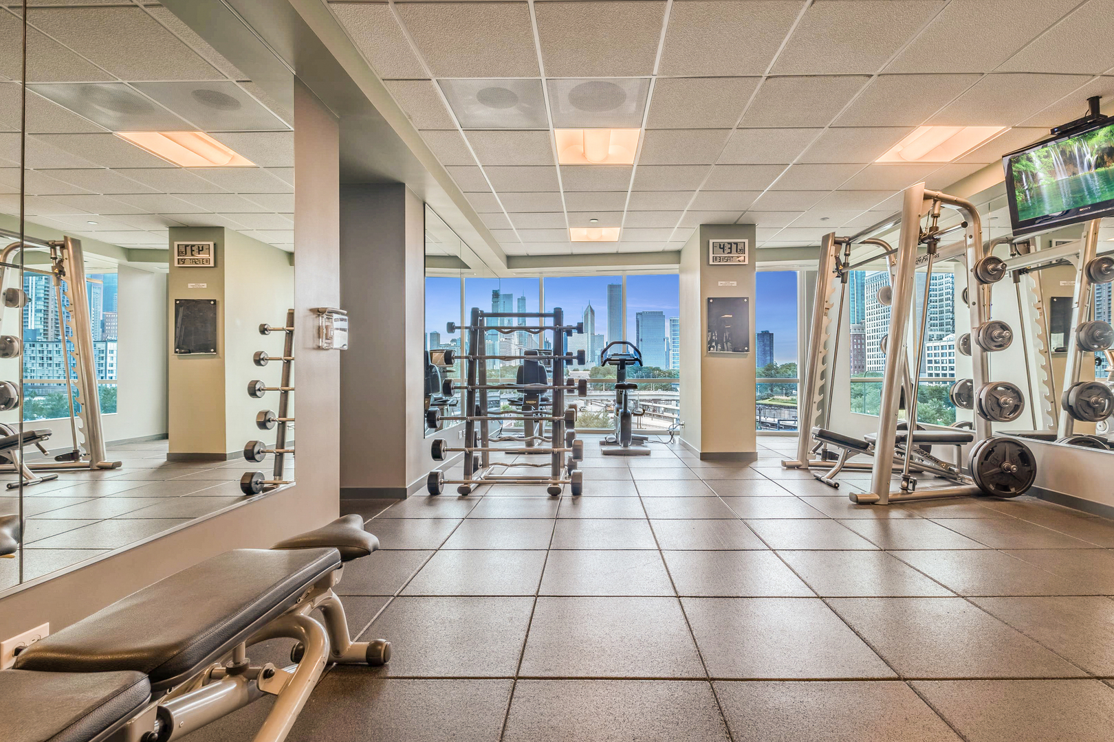1201 South Prairie Avenue, Unit 601 Chicago, IL 60605 - Photo 38 of 52 a room with gym equipment and glass windows