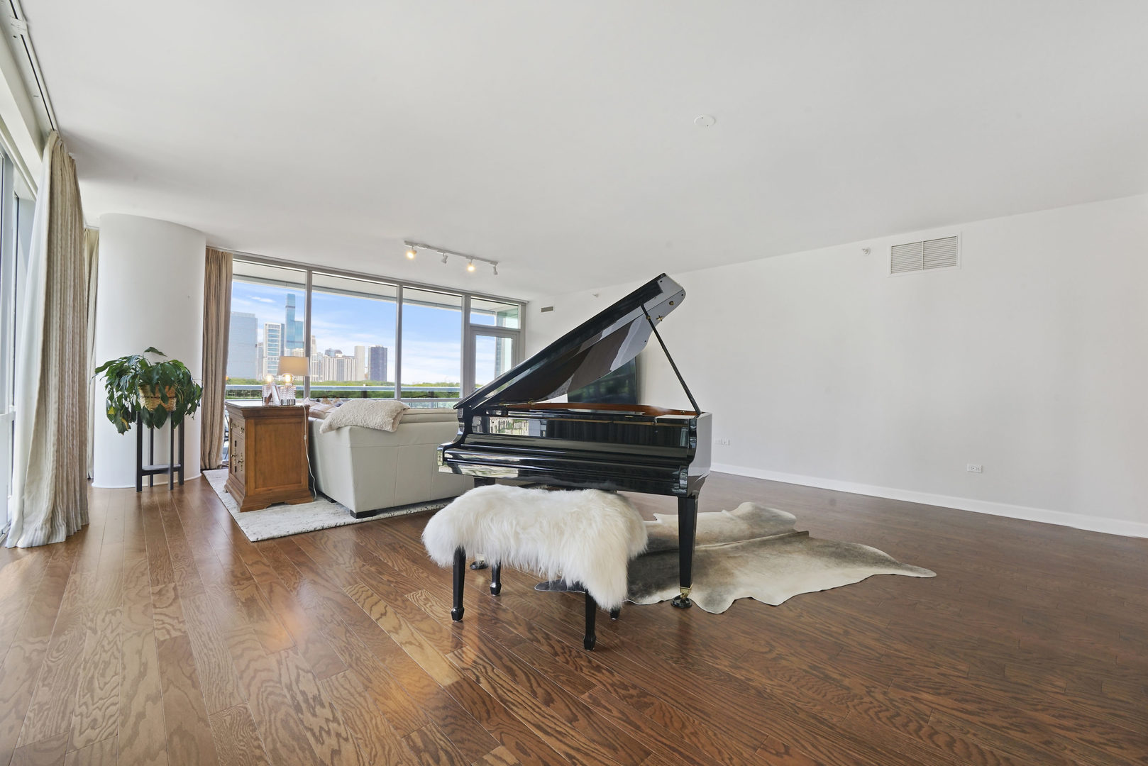 1201 South Prairie Avenue, Unit 601 Chicago, IL 60605 - Photo 8 of 52 a living room with furniture and a wooden floor