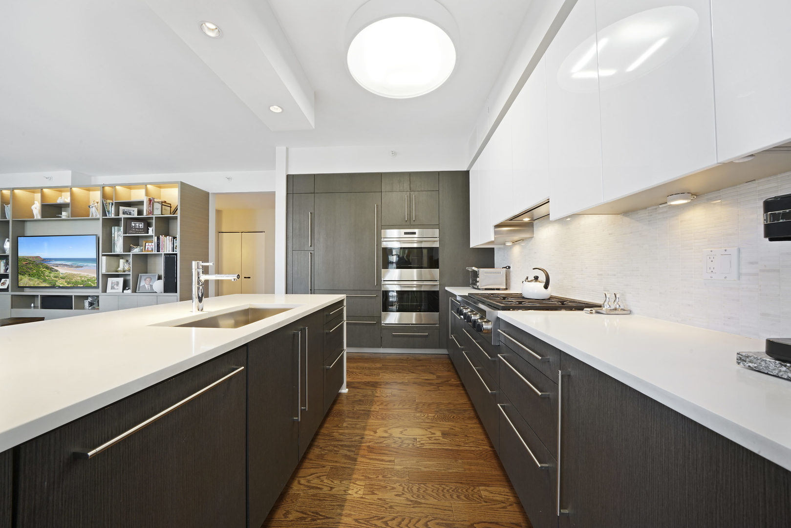 1201 South Prairie Avenue, Unit 601 Chicago, IL 60605 - Photo 10 of 52 a large kitchen with stainless steel appliances a sink and a stove