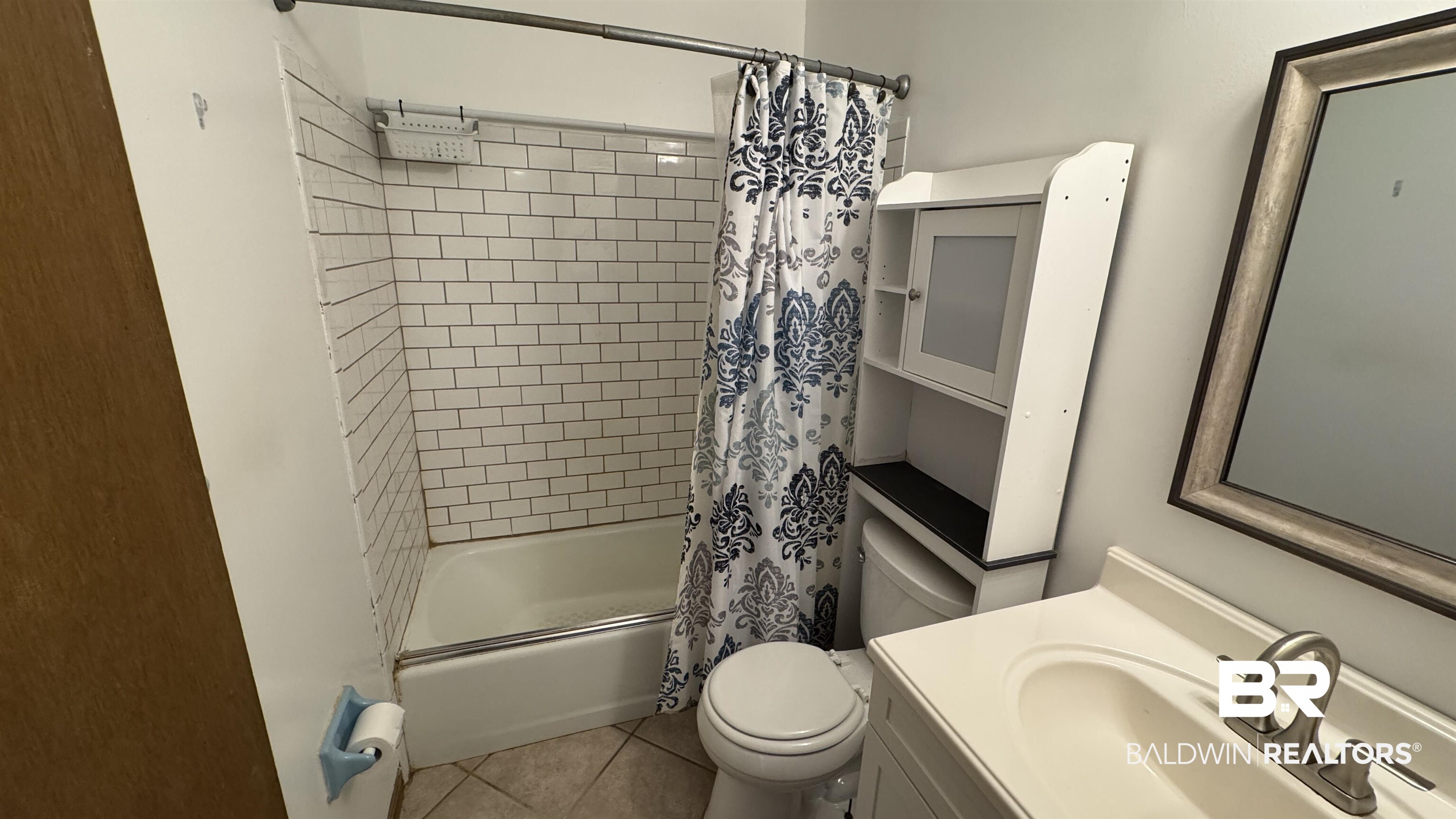 33370 Highway 98 Lillian, AL 36549 - Photo 34 of 58 Bathroom featuring a white subway tile shower surround and a built-in bathtub