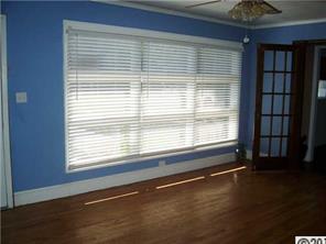 2703 South Point Road Belmont, NC 28012 - Photo 5 of 15 a view of empty room with wooden floor and fan
