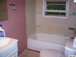 2703 South Point Road Belmont, NC 28012 - Photo 9 of 15 a white bath tub sitting next to a toilet