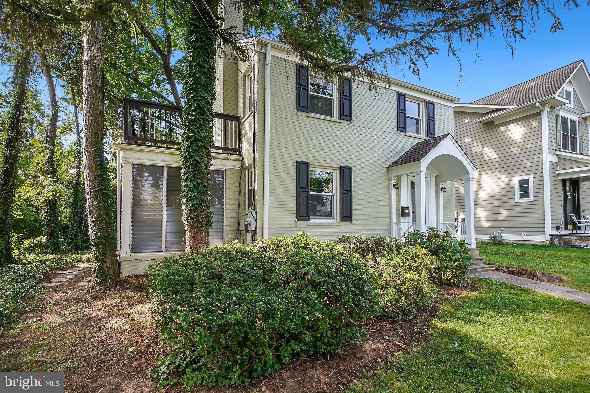 7000 Exeter Road Bethesda, MD 20814 - Photo 2 of 31 front view of a house with a garden