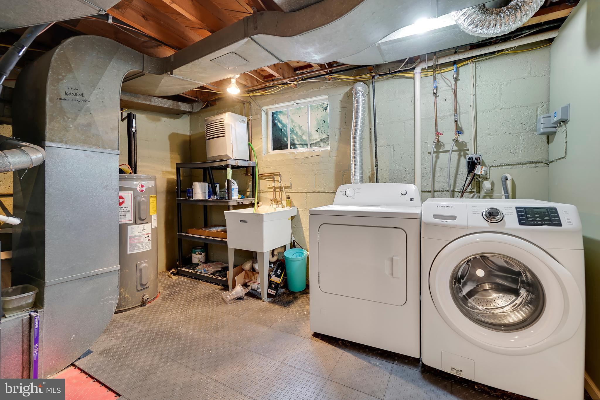 7000 Exeter Road Bethesda, MD 20814 - Photo 29 of 31 a utility room with dryer and washer