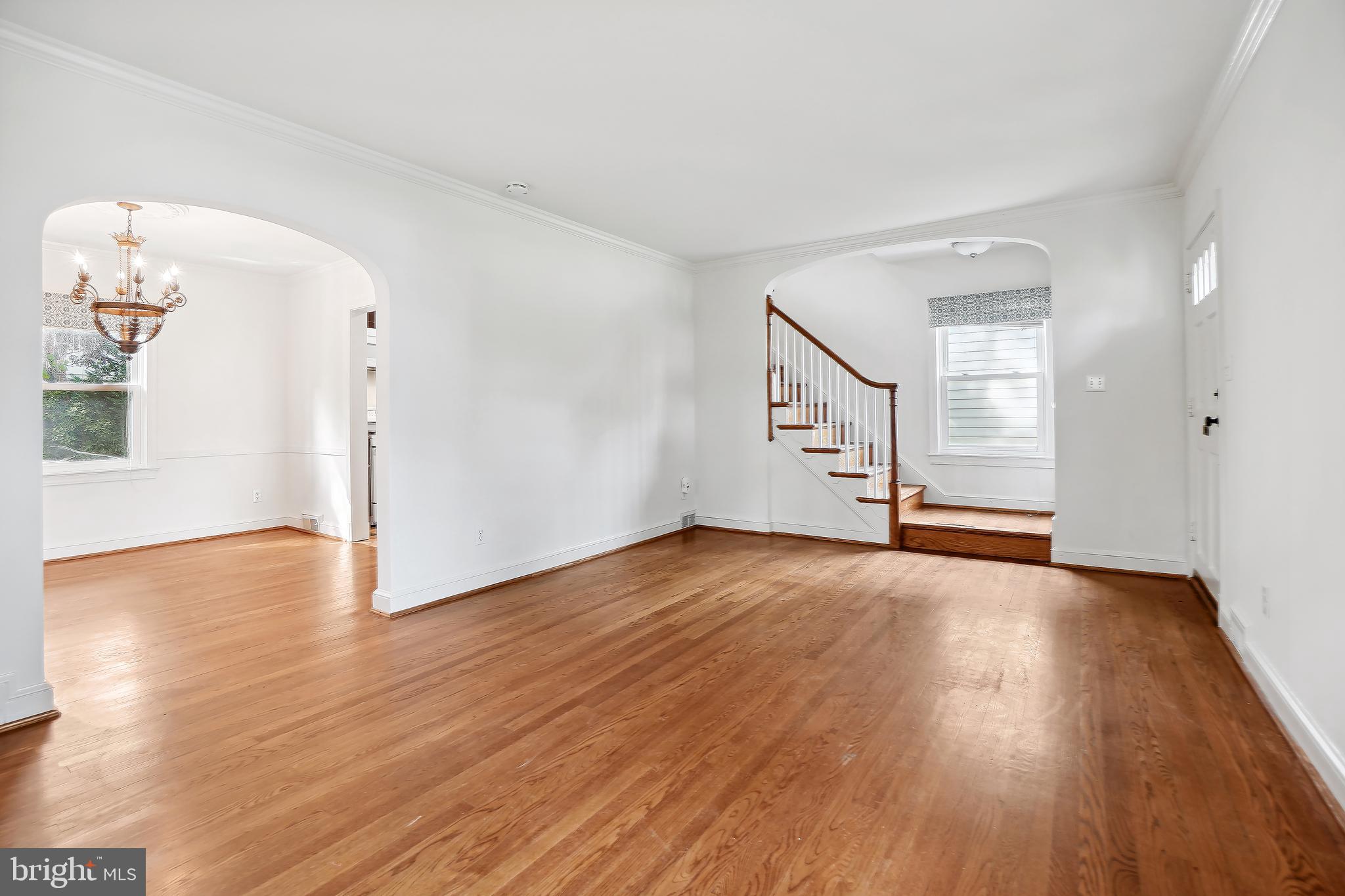 7000 Exeter Road Bethesda, MD 20814 - Photo 6 of 31 a view of empty room with wooden floor and fan