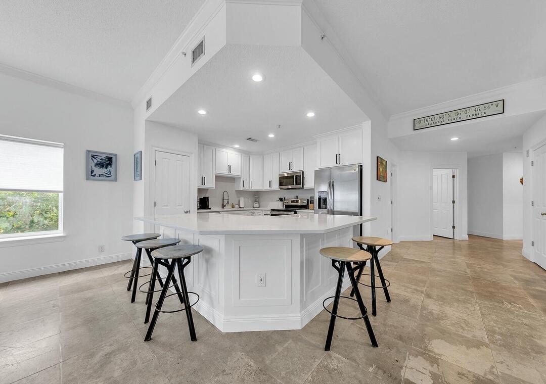 3880 East County Highway 30A, Unit 104 Santa Rosa Beach, FL 32459 - Photo 11 of 49 a kitchen with a table and chairs in it