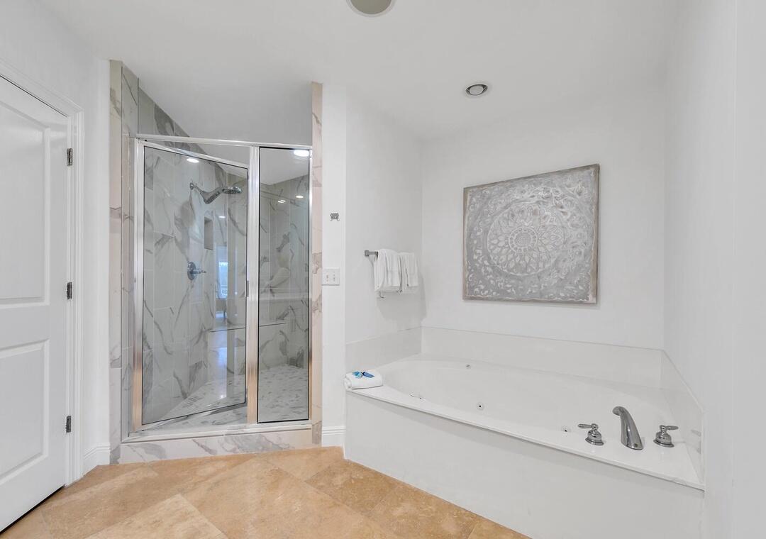 3880 East County Highway 30A, Unit 104 Santa Rosa Beach, FL 32459 - Photo 22 of 49 a bathroom with a bathtub and shower